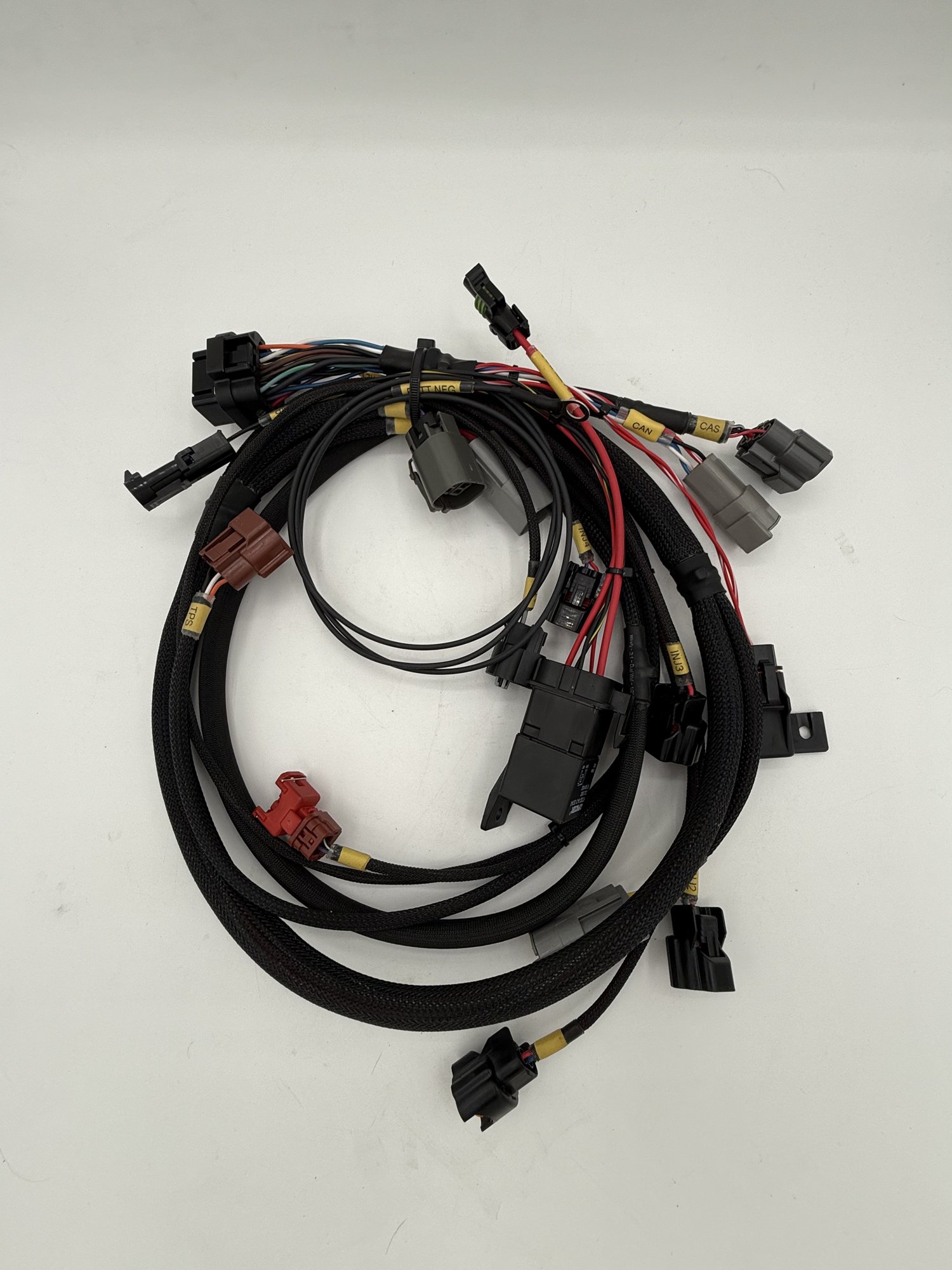SR20DET EFI engine harness built in-house by SNP Speed Innovations — full harness with labeled connectors on the bench